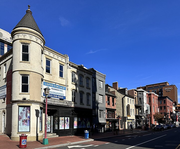 A mixed-use property with shops on the ground floor and apartments above.